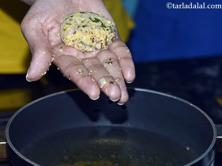 Step 19 – Flatten the ball between your palms to make a round flat vada and directly put …