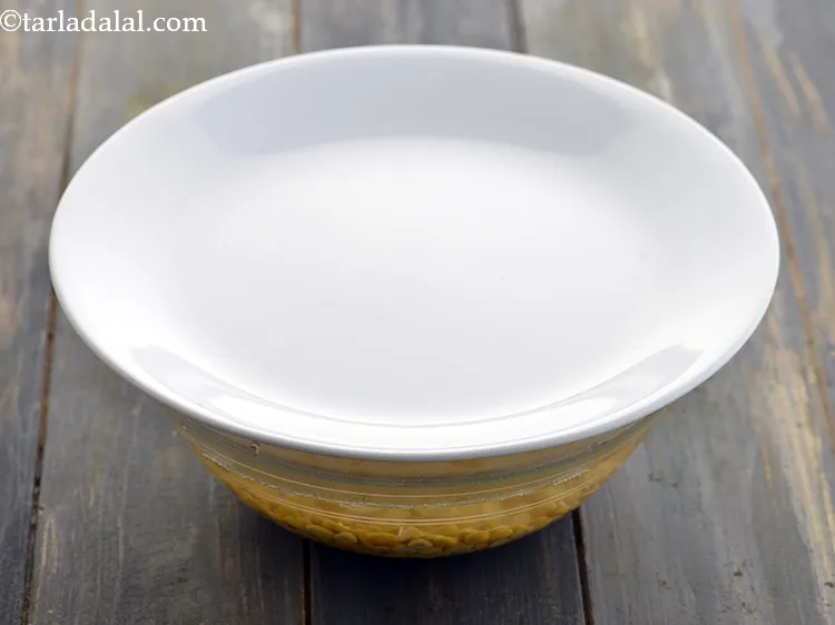 Step 20 – Cover the dal with a lid and soak for 1 hour.&nbsp;