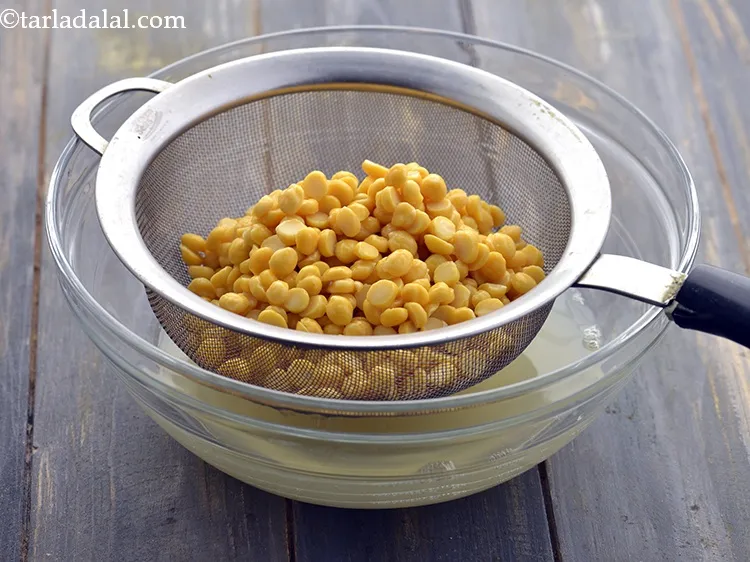 Step 21 – Drain the dal using a strainer. Keep aside.&nbsp;