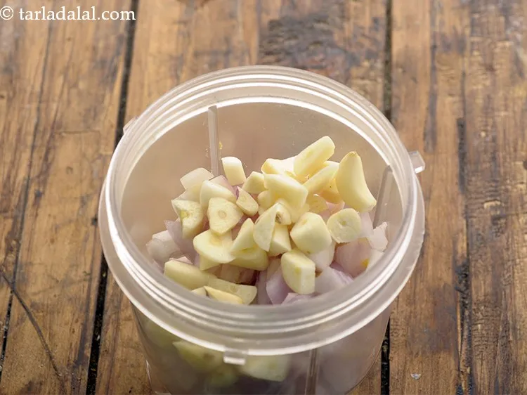 Step 3 – Add garlic cloves.