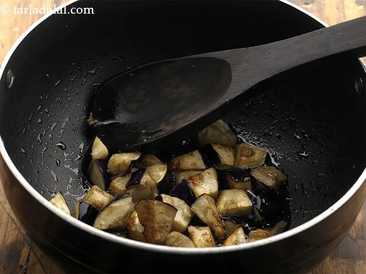 Step 9 – Cook on a low flame for 4 to 5 minutes or till the brinjal pieces …