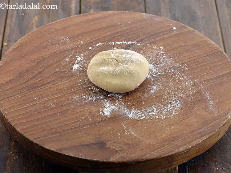 Step 11 – Sprinkle a little flour on your rolling board and flatten a portion of the dough …