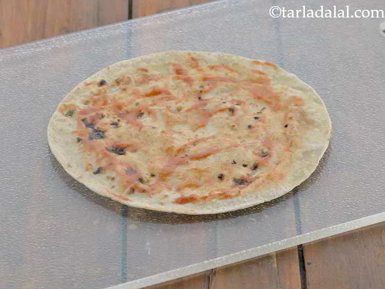 Step 16 – Spread ? tsp of chilli sauce evenly over it.