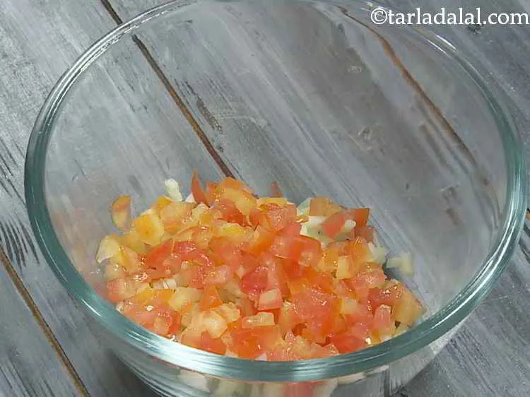 Step 6 – Add deseeded and finely chopped tomatoes to it.
