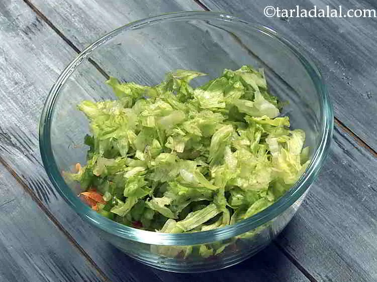 Step 10 – Now add shredded lettuce. To make the lettuce crunchy, dip the leaves in ice-cold water …
