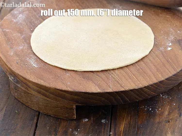 Step 20 – <meta charset="UTF-8" /> Using a little whole wheat flour for rolling, start rolling out the …