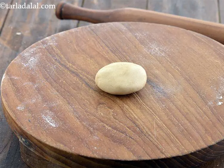 Step 23 – Sprinkle a little flour on your rolling board and flatten a portion of the dough …