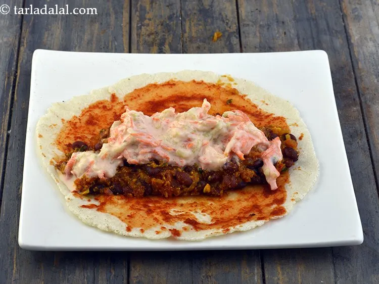 Step 33 – Spread &frac14;th of the curd dressing over it.