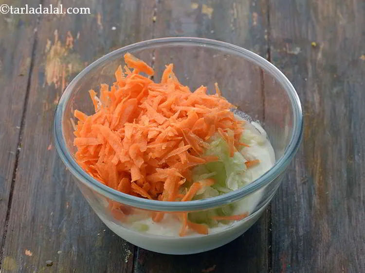 Step 27 – Add 1/2 cup&nbsp;<a href="https://www.tarladalal.com/glossary-grated-carrot-816i">grated carrot</a>.