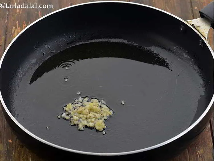 Step 10 – Add 2 tsp&nbsp;finely&nbsp;<a href="https://www.tarladalal.com/glossary-chopped-ginger-786i">chopped ginger (adrak)</a>.