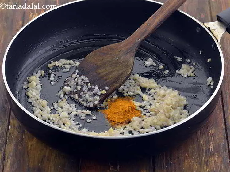 Step 14 – Add 1/2 tsp&nbsp;<a href="https://www.tarladalal.com/glossary-turmeric-powder-haldi-645i">turmeric powder (haldi)</a>.