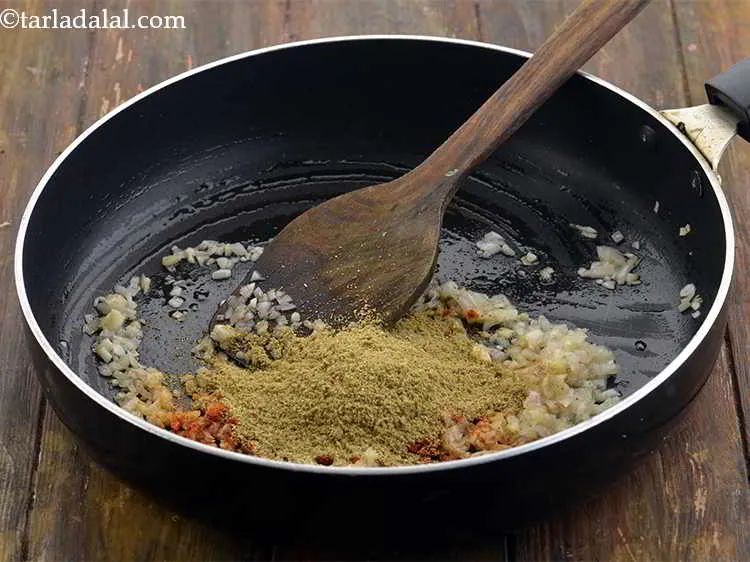 Step 16 – Add 1 tbsp&nbsp;<a href="https://www.tarladalal.com/glossary-coriander-powder-dhania-powder-370i">coriander (dhania) powder</a>.