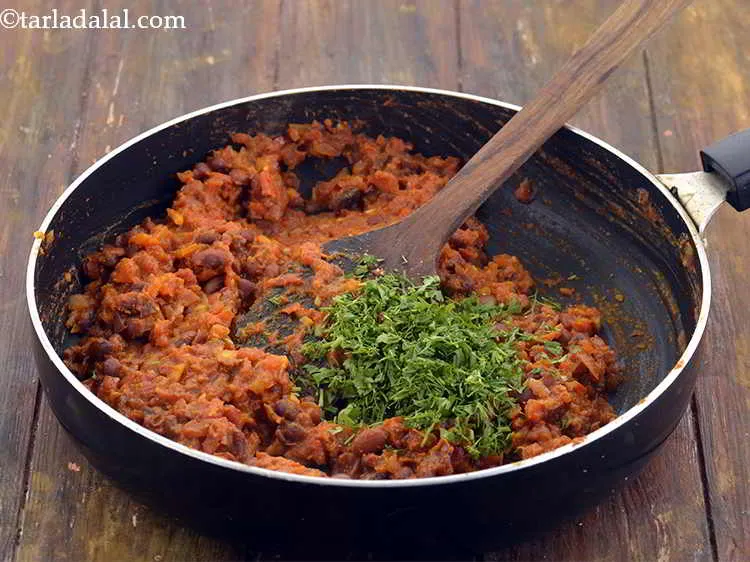 Step 21 – Add 2 tbsp&nbsp;<a href="https://www.tarladalal.com/glossary-chopped-coriander-783i">chopped coriander (dhania)</a>.