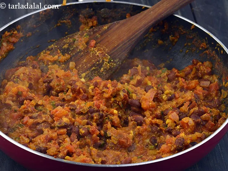 Step 23 – Mix well and cook on a medium till the mixture dries up, while stirring continuously.