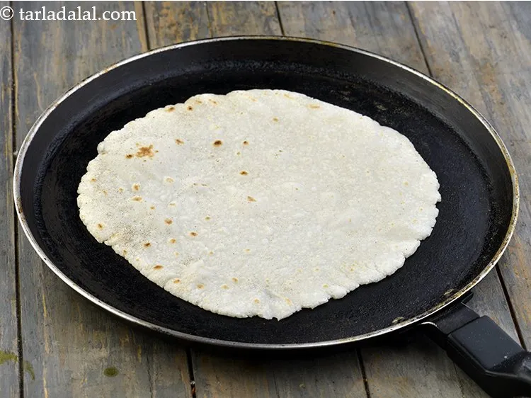 Step 8 – Cook each roti very lightly on a tava (griddle) and keep aside.