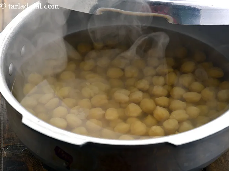 Step 6 – Pressure cook it for 3 to 4 whistles over a medium flame or until they …
