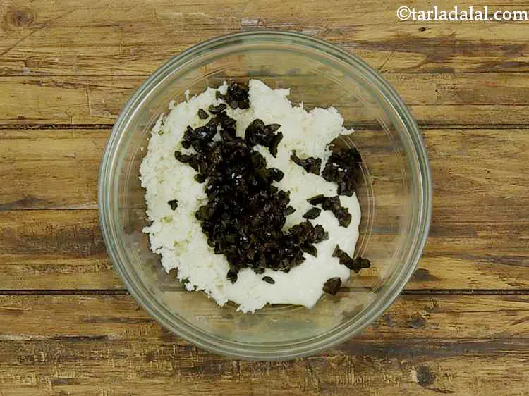 Step 3 – Now add the finely chopped black olives. You can even cut them into slices but …