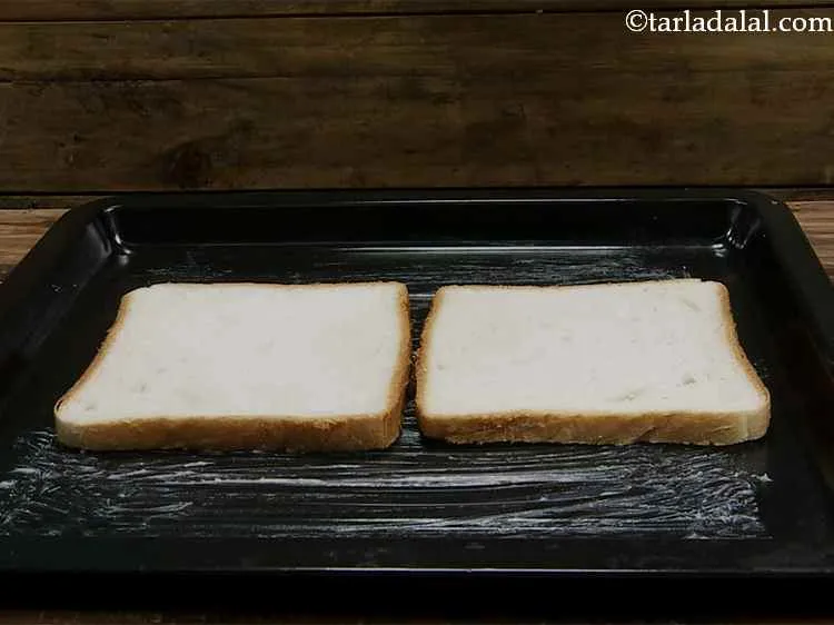 Step 9 – Spread ? tsp of butter on each bread slice and place it on the baking …