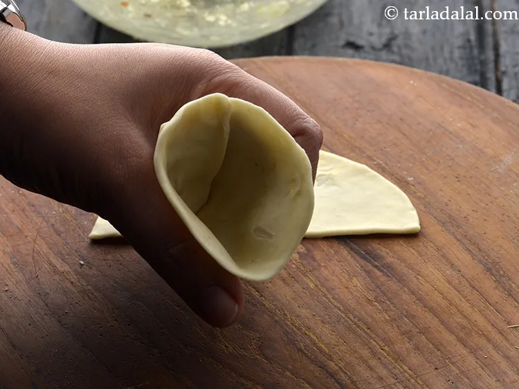 Step 36 – Take a portion and join the edges to make a cone.