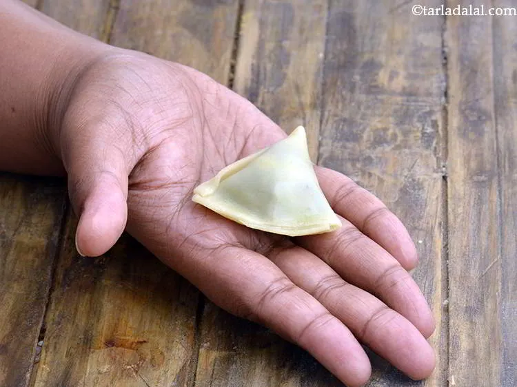 Step 39 – Pinch it well to seal the stuffing.