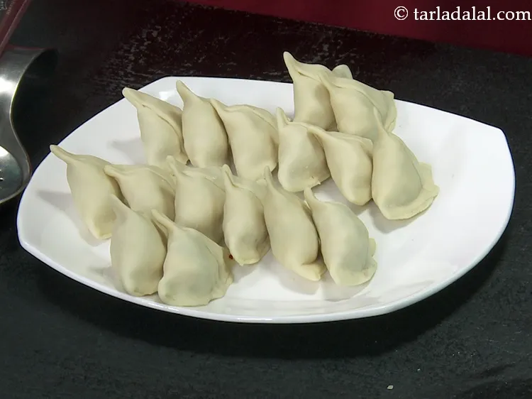 Step 40 – This is one samosa shaped and ready. Repeat with the remaining dough and stuffing to …