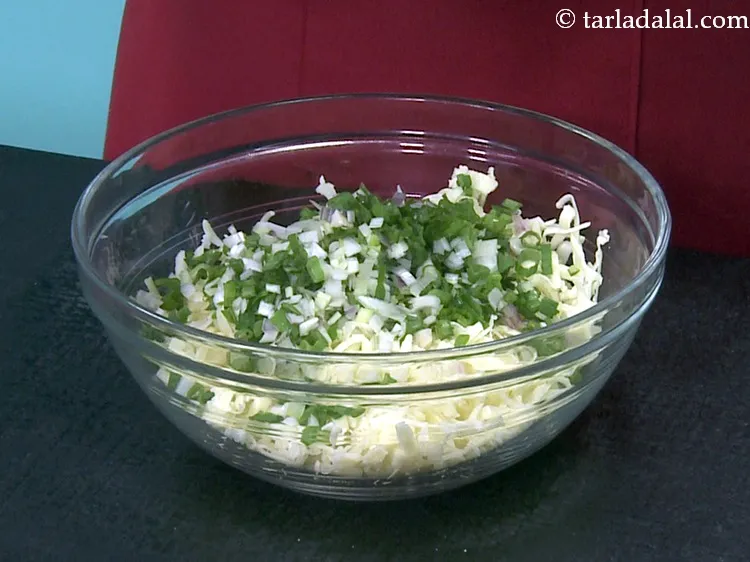 Step 27 – Add 1/2 cup&nbsp;finely chopped&nbsp;<a href="https://www.tarladalal.com/glossary-chopped-spring-onion-whites-815i">spring onion whites</a>&nbsp;and&nbsp;<a href="https://www.tarladalal.com/glossary-chopped-spring-onion-greens-1030i">greens</a>.