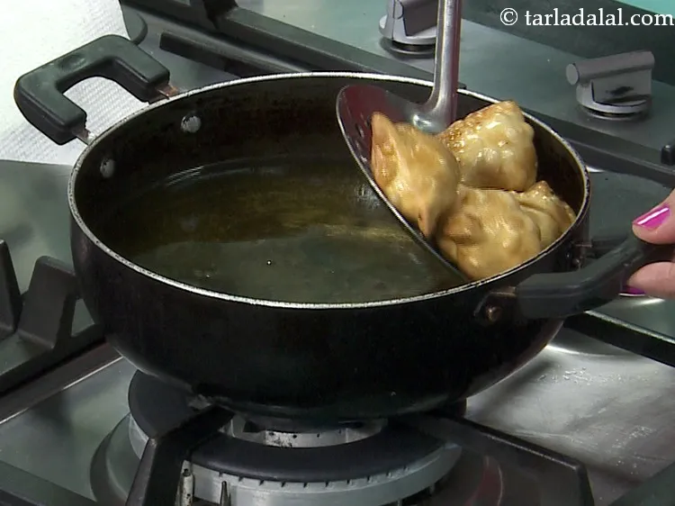 Step 43 – Deep fry on a medium flame till they turn golden brown in colour from both …
