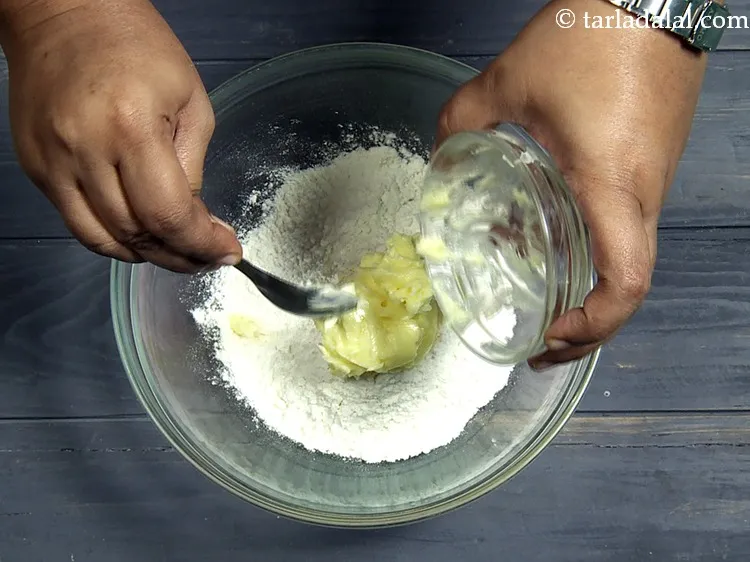 Step 14 – Add 1/4 cup&nbsp;cold&nbsp;<a href="https://www.tarladalal.com/glossary-butter-makhan-233i">butter</a>.&nbsp;