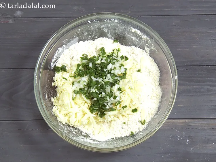 Step 21 – Add 1/4 cup&nbsp;finely&nbsp;<a href="https://www.tarladalal.com/glossary-chopped-spring-onion-whites-815i">chopped spring onion whites</a>&nbsp;and&nbsp;<a href="https://www.tarladalal.com/glossary-chopped-spring-onion-greens-1030i">greens</a>.