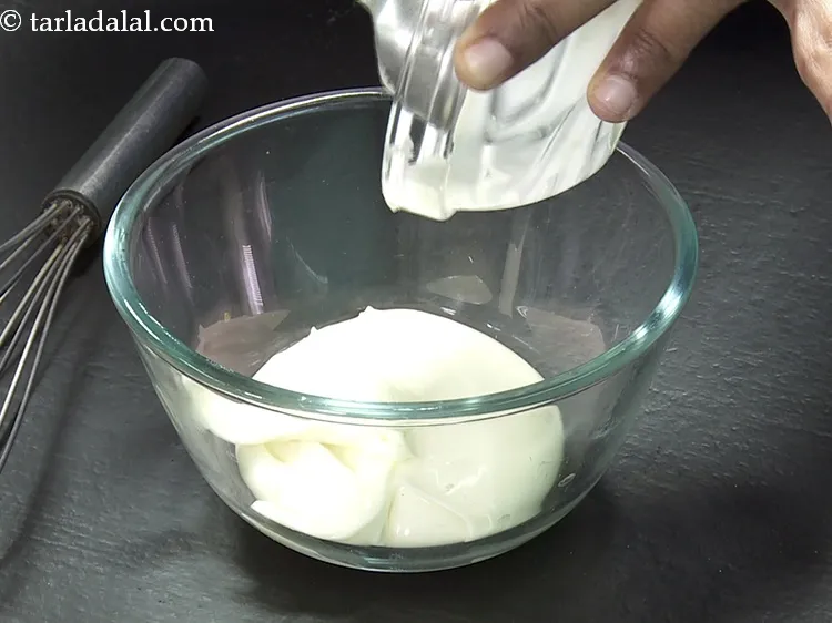 Step 31 – For the cheese sauce mixture, add 1/2 cup&nbsp;<a href="https://www.tarladalal.com/glossary-cheese-spread-309i">cheese spread</a> in a deep bowl.