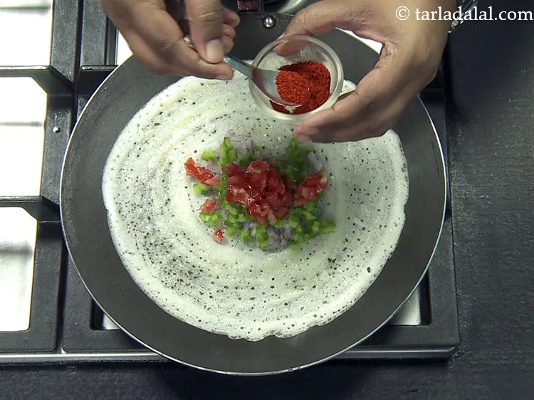 Step 46 – Put &frac14; tsp of <a href="https://www.tarladalal.com/glossary-chilli-powder-red-chilli-powder-339i">chilli powder</a>.