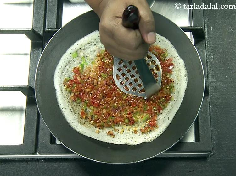 Step 50 – Then mash it very lightly using a potato masher and cook on a medium flame …