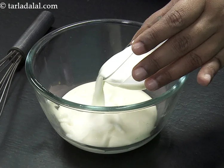 Step 32 – Add 2 tbsp&nbsp;<a href="https://www.tarladalal.com/glossary-milk-doodh-full-fat-milk-buffalo-milk-full-cream-milk-514i">milk</a>.