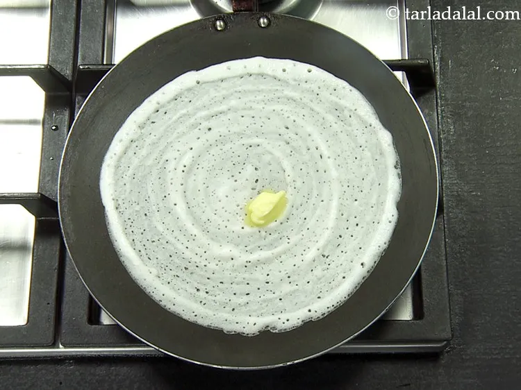 Step 40 – Put 1 tsp of <a href="https://www.tarladalal.com/glossary-butter-makhan-233i">butter</a>.