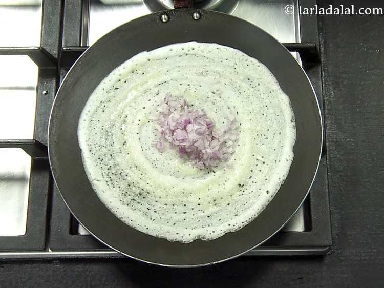 Step 43 – Put 2 tbsp of&nbsp;finely&nbsp;<a href="https://www.tarladalal.com/glossary-chopped-onions-722i">chopped onions</a>.