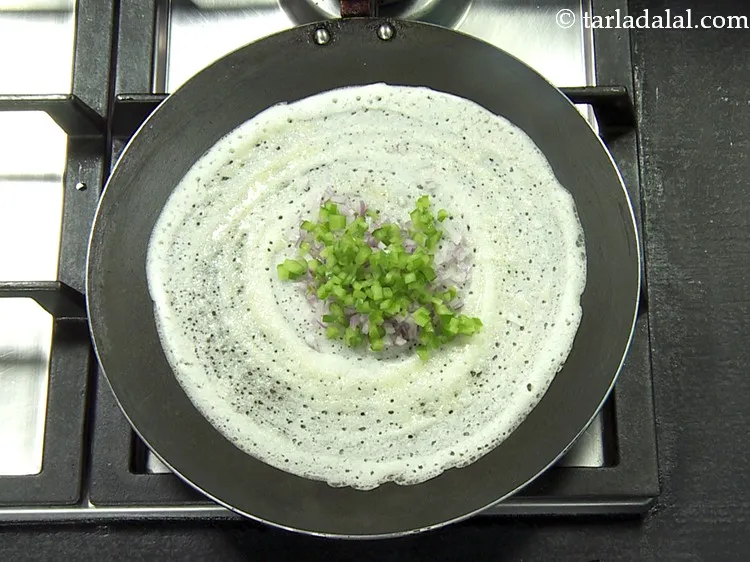 Step 44 – Put 1 tbsp of finely&nbsp;<a href="https://www.tarladalal.com/glossary-chopped-capsicum-164i">chopped capsicum</a>.