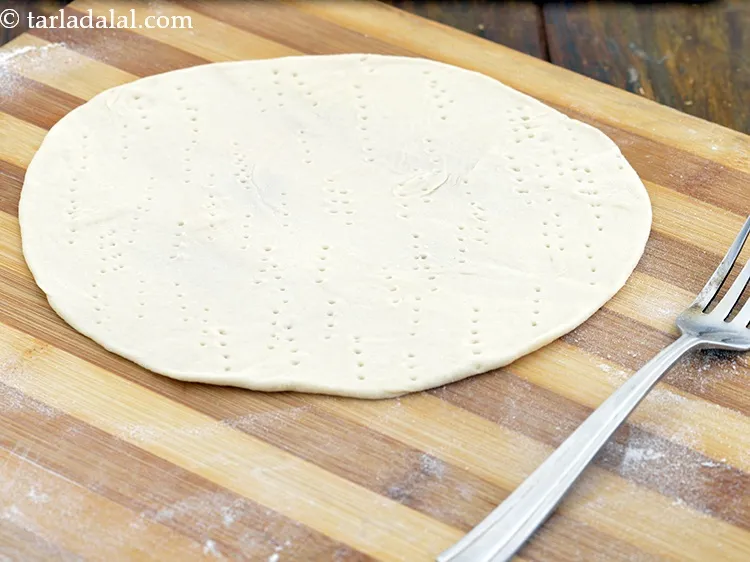 Step 22 – Prick it with a fork uniformly.