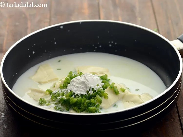 Step 5 – Add 1/2 tbsp cornflour. It will help in thickening our <strong>cheese dip</strong>.&nbsp;