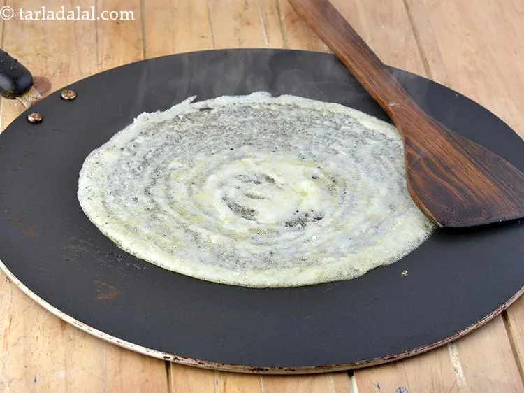 Step 9 – Cook <strong>street style butter cheese dosa</strong> on medium flame till the dosa turns light brown …