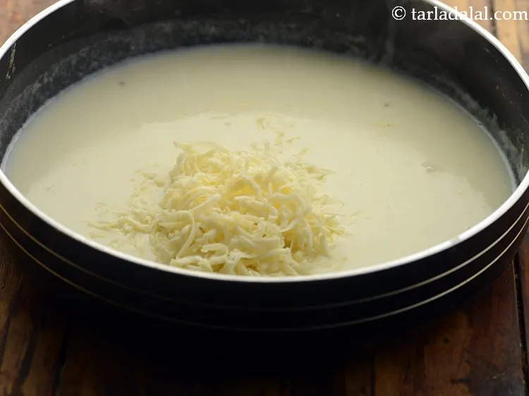 Step 9 – Reduce the flame, add the white wine and cheese.