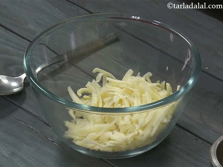 Step 4 – In a small bowl, take the grated cheese.