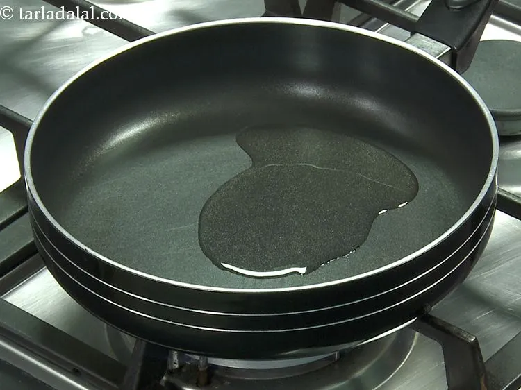 Step 2 – For the <strong>stuffing of cheese masala toast sandwich</strong>, heat the oil in a broad non-stick …