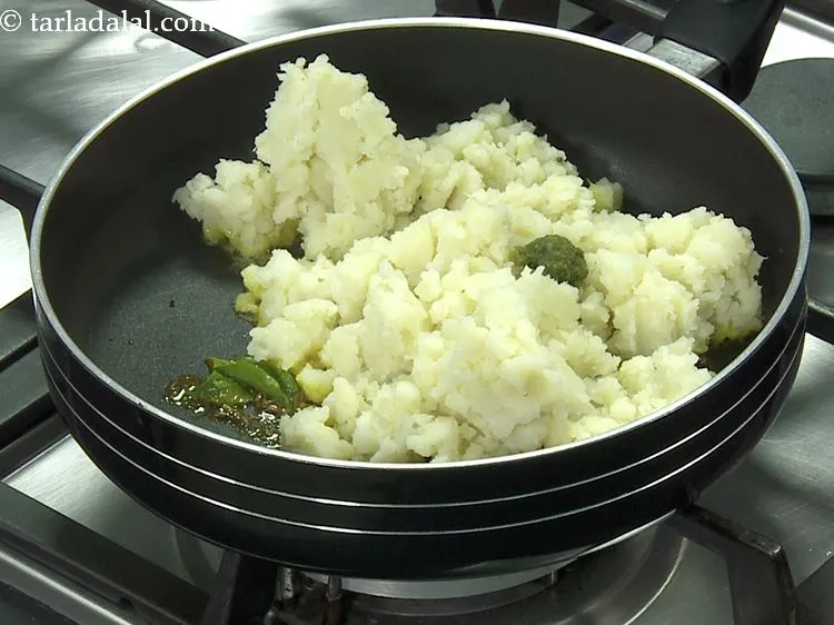 Step 11 – Add the green chilli paste. You can add finely chopped chillies if you wish to.&nbsp;