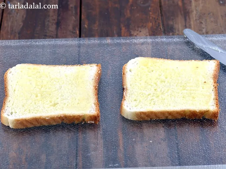 Step 19 – Apply &frac12; tsp of butter on each bread slice.