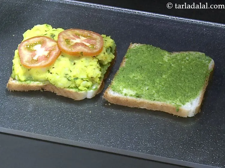 Step 22 – Arrange 2 tomato slices.&nbsp;