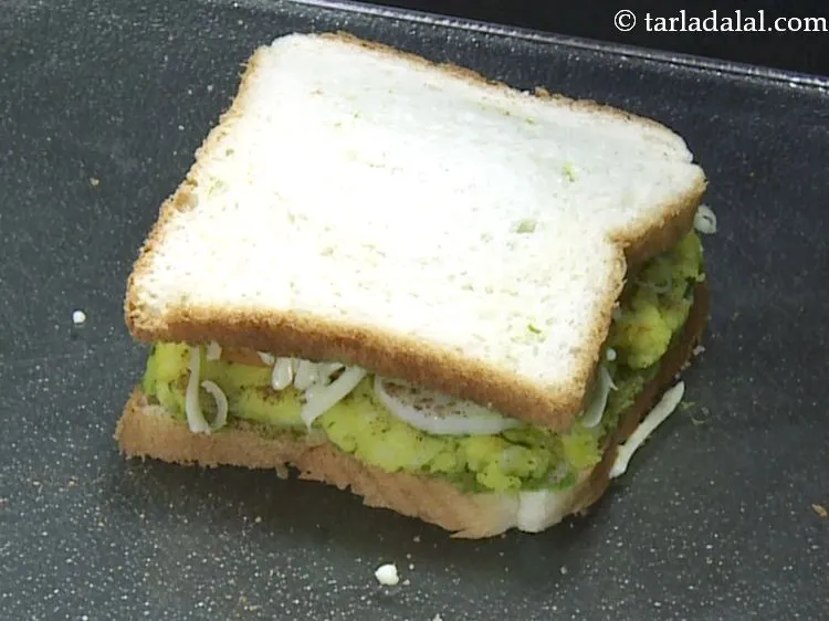 Step 28 – Cover it with another slice of bread, with the buttered-chutney side facing downwards and press …