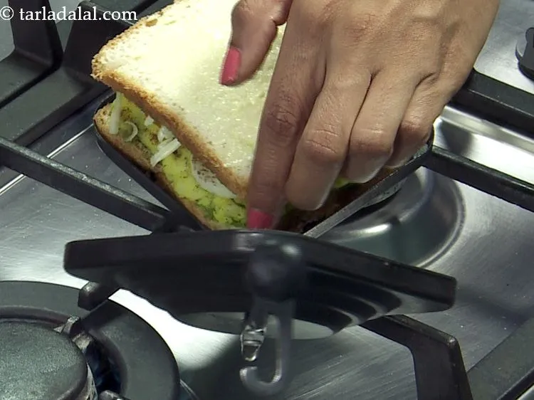 Step 30 – Place the sandwich in a greased sandwich toaster.