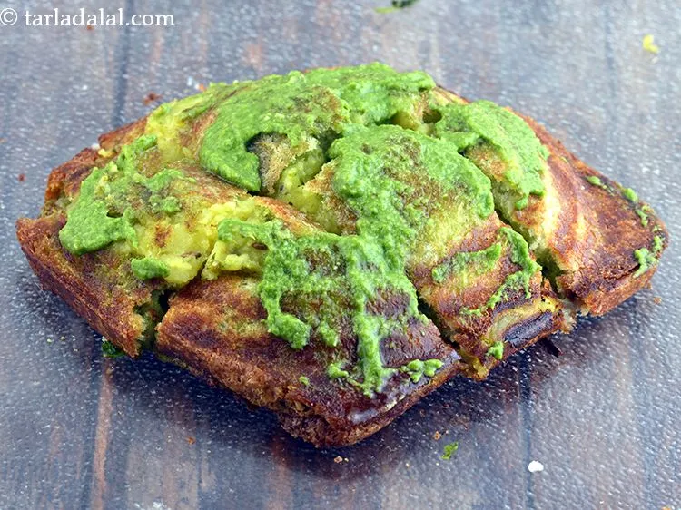 Step 34 – Also spread &frac12; tsp of green chutney evenly over it. You can also sprinkle some …