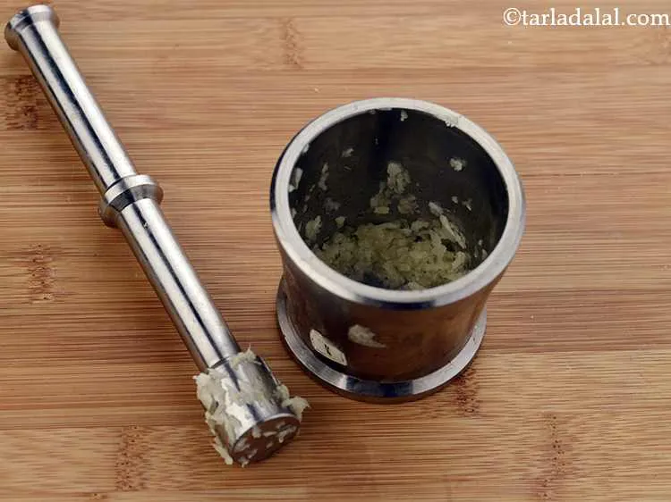 Step 3 – Crush the garlic cloves using a mortar pestle. The aroma and flavour of freshly pounded …