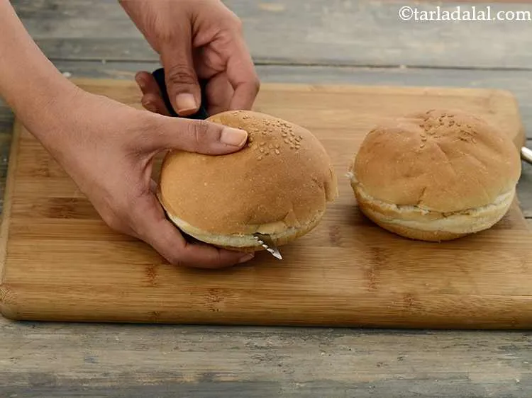 Step 2 – Slice each bun horizontally into 2 halves and keep aside. This recipe can be made …